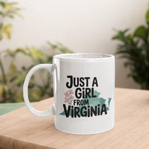 a coffee mug that says "Just a girl from virginia"