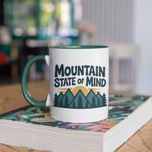 a coffee mug that says "Mountain state of mind" with a mountain graphic. this design is part of A collection of west virginia vector designs perfect for cricut, silhouette, sublimation, DTF Printing, POD, tshirts, mugs, tote bags and more!