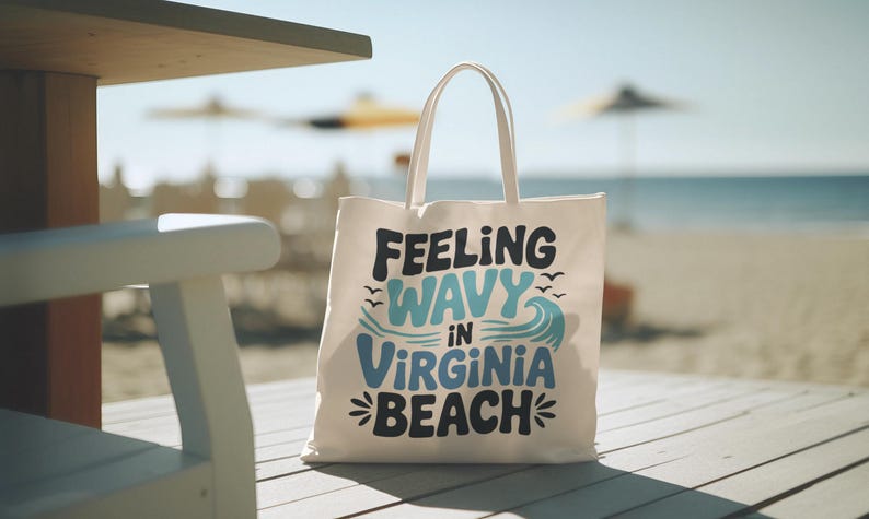 a white canvas beach bag that says "Feeling wavy in virginia beach"