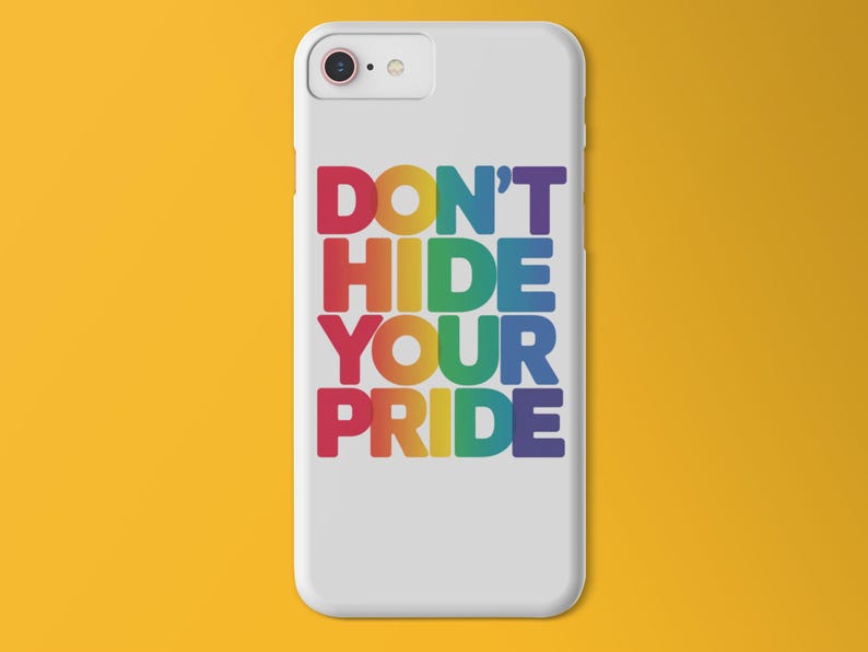 A phone case with a graphic that says "dont hide your pride" with rainbow colored font on a yellow/orange background