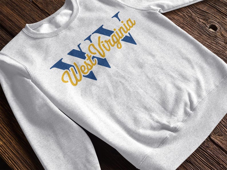 a heather white sweatshirt that says "WV West Virginia". this design is part of  A collection of west virginia vector designs perfect for cricut, silhouette, sublimation, DTF Printing, POD, tshirts, mugs, tote bags and more!