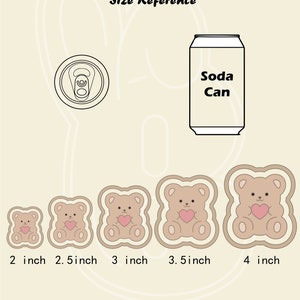 May include: Size reference guide for bear-shaped cookie cutters. The cutters are shown in five sizes: 2 inches, 2.5 inches, 3 inches, 3.5 inches, and 4 inches. Each cutter features a brown bear with a pink heart.