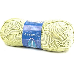 May include: A skein of light green yarn with a blue label that says "fonid" and "SPORTWEIGHT" with care instructions. The label also includes the yarn weight, needle size, and other information.