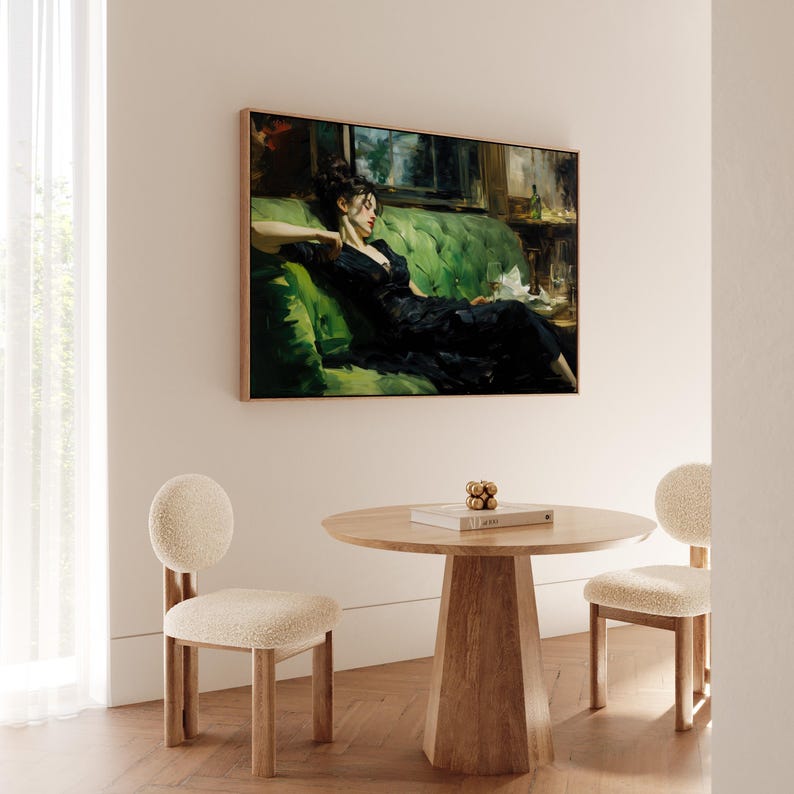 a painting of a woman in a black dress sitting on a green couch, with a wooden table and two white chairs in front of her.