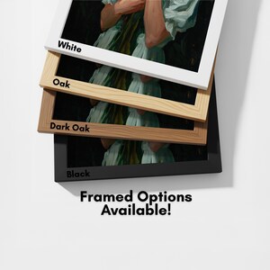 a collection of framed artworks, each with a different color frame, arranged in a stack. The text "framed options available!" is visible, indicating that the framed options are available for purchase.