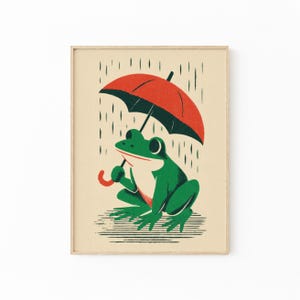 以下が含まれることがあります： 大きな赤い傘をさして雨の中に座っている緑色のカエルのアートプリント。クリーム色の背景に、濃い緑色の雨の線と地面を表す水平線が描かれたイラストレーション。額縁に入った状態で表示されています。