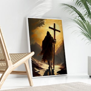 a person carrying a cross, standing in a desert-like setting with mountains in the background.
