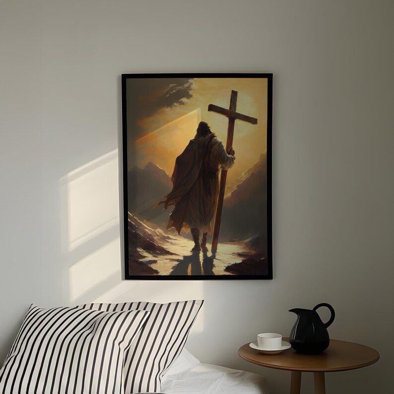 a person carrying a large cross, standing in a snowy landscape with mountains in the background.