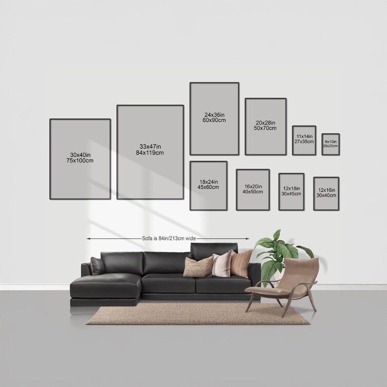 a living room with a large black sectional sofa, a chair, and a rug. Above the sofa, there are nine framed artworks of varying sizes displayed on the wall. The artworks are arranged in a grid-like pattern, with each frame having a specific size and dimensions. The wall is painted white, and the furniture and artworks create a cohesive and visually appealing interior design.