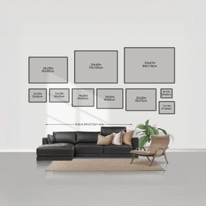 a living room with a black leather sofa and a chair, along with a rug on the floor. Above the furniture, there are nine framed artworks of varying sizes, each with a different width and height, ranging from 24x36 to 60x90cm. The artworks are arranged in a grid-like pattern on the wall, creating a visually appealing display.