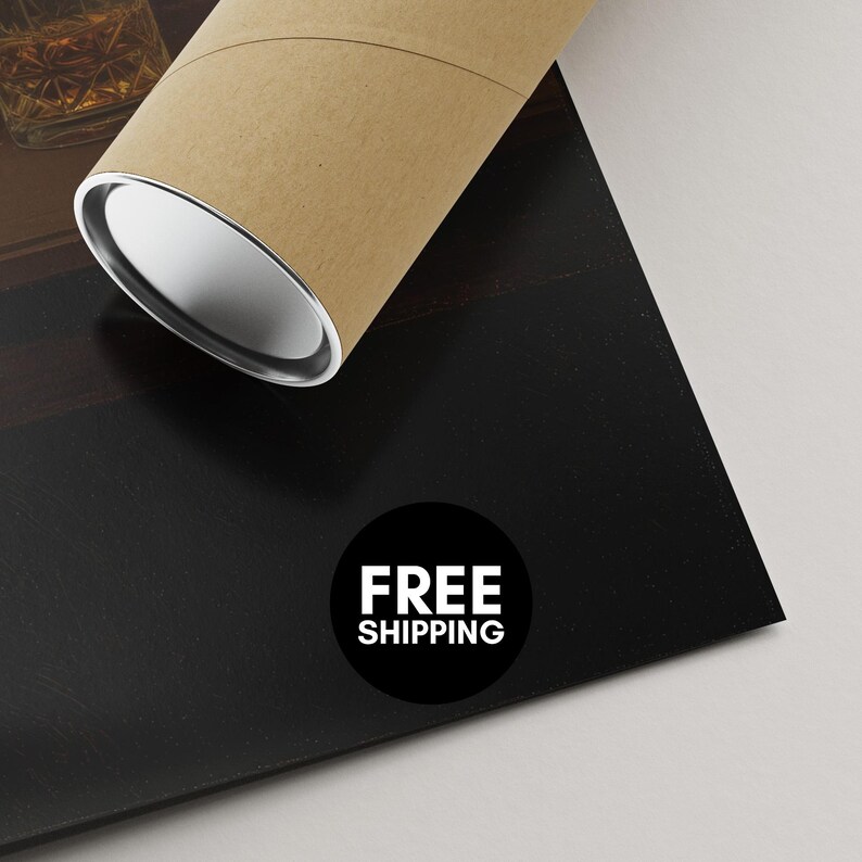 a cardboard tube with a white label that says "FREE SHIPPING" on a black surface.