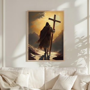 a person carrying a large cross, walking through a mountainous landscape under a bright, golden sky.