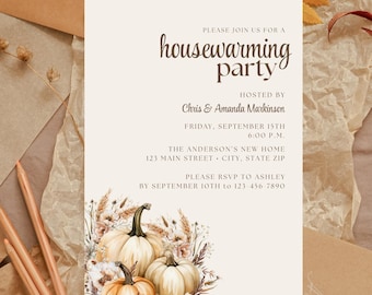 May include: Cream-colored housewarming party invitation with text and floral and pumpkin illustrations. The text reads "housewarming party" and includes the hosts' names, date, time, and address. RSVP information is also included.