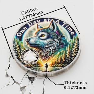 May include: Silver-toned round coin with a colorful image of a wolf in a forest. The coin has the text "One Day at A Time" around the edge and a triangle with the words "Unity", "Service", and "Recovery" inside. The coin is 1.37 inches in diameter and 0.12 inches thick.