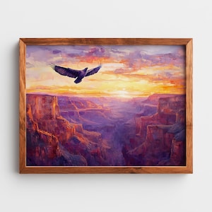 May include: A framed landscape painting depicts a majestic eagle soaring over a canyon at sunset. The artwork features vibrant colors, with the canyon walls in shades of red and purple, and the sky ablaze with orange and yellow hues.