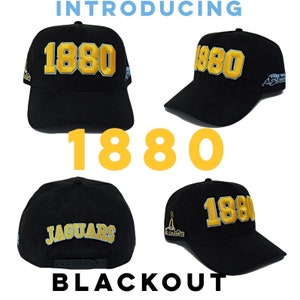 May include: Black baseball cap with gold embroidered "1880" on the front. The cap also features "JAGUARS" on the back and "AC CHAMPS" on the side. The word "BLACKOUT" is at the bottom of the image.