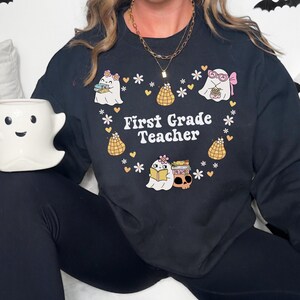Halloween First Grade Teacher Sweatshirt, Comfort Colors First Grade Shirt, 1st Grade Teacher Shirt,Gift For Teacher,Groovy Teacher Sweater
