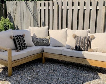 Elevate your outdoors! Craft a chic wood patio sectional with our easy DIY plans. Start building today for a stylish space!