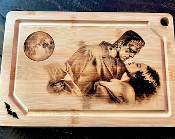 Cutting Board -  Frankenstein and Bride embraced engraved on heavy duty Bamboo wood.  Classic Monsters. Universal Monsters Charcuterie Board