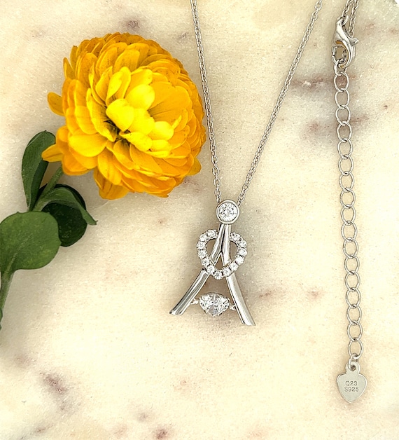 Snowflake Dancing Cubic Zirconia Pendant Two Tone Rhodium on Sterling Silver Snowflake Dancing Cubic Zirconia Pendant Two Tone Rhodium on Sterling Silver