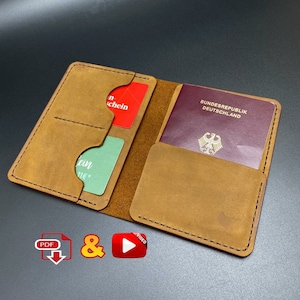 May include: A brown leather passport holder with multiple pockets for cards and a larger pocket for a passport. The passport pocket has a German passport inside with the text "Bundesrepublik Deutschland" on the cover.