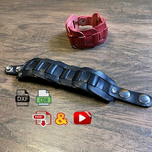 Könnte beinhalten: Zwei Lederarmbänder. Eines ist schwarz, das andere rot. Beide haben ein geflochtenes Design. Das schwarze Armband ist lang und hat silberne Knopfverschlüsse. Das rote Armband ist im Manschettenstil mit einem einzelnen Knopfverschluss. Das Bild enthält auch Symbole für DXF, CDR, PDF, ein kaufmännisches Und und ein Video.