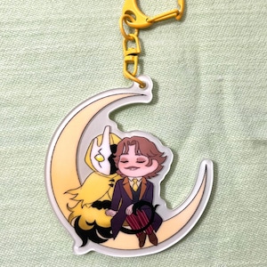 Malevolent Podcast Glow in the Dark Acrylic Keychain | Arthur Lester | John Doe