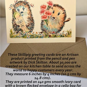 May include: Greeting card featuring two illustrated hedgehogs. One holds a wine bottle, the other flowers. The card reads "Happy Anniversary" and is printed on ivory cardstock. The card measures 6 inches by 4 inches.
