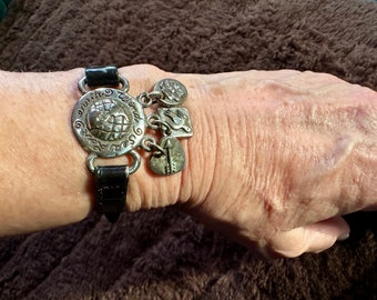Brighton Retired Leather, Sea, Wind, Love, Earth,  Flower, Bird and Arrow charm bracelet.