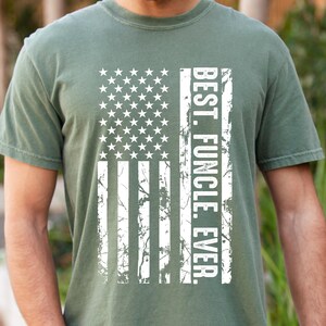 May include: A green t-shirt with a distressed white American flag design and the text "BEST. FUNCLE. EVER."
