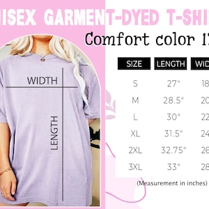 May include: A unisex garment-dyed t-shirt in a light purple color. The t-shirt has a relaxed fit and is shown on a model. The size chart shows the length and width of the t-shirt in inches for sizes S through 3XL.