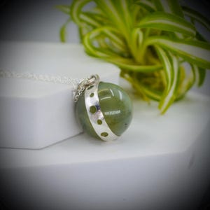 May include: A set of three ceramic mugs with a speckled, matte finish. The mugs are in shades of cream, light gray, and dark gray. Each mug has a simple, minimalist design, perfect for coffee or tea.