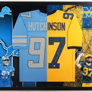 May include: Framed display featuring a split design: a light blue Detroit Lions jersey and a yellow Michigan Wolverines jersey. Both jerseys display the number 97 and the name HUTCHINSON. The Lions jersey has silver stripes.