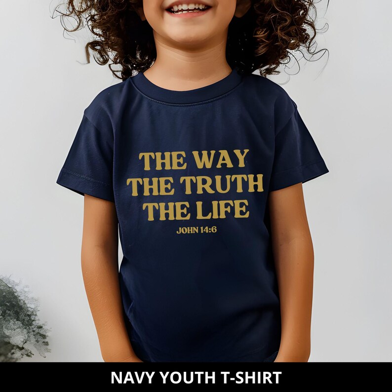May include: Navy blue youth t-shirt with gold text: "THE WAY THE TRUTH THE LIFE" and "JOHN 14:6". The shirt is a classic crew neck style. The bottom of the image reads "NAVY YOUTH T-SHIRT".