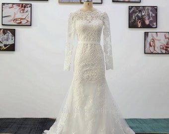 Abito da sposa a sirena in pizzo: maniche lunghe, scollo a cuore