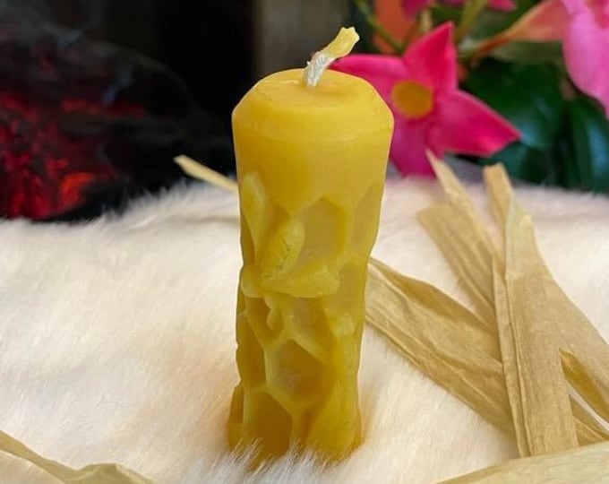 Small decorative candle with bee and honeycombs