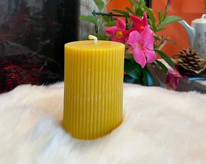Pillar candle with grooves