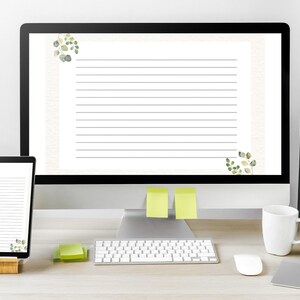 May include: A desktop setup featuring a computer monitor and a tablet displaying lined paper with watercolor eucalyptus accents. A white mug, green apple, and keyboard are also visible, suggesting a workspace or stationery theme.
