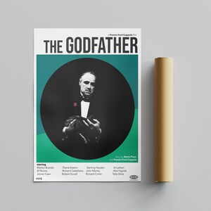 May include: A vintage movie poster for The Godfather, featuring a black and white image of Marlon Brando as Don Vito Corleone holding a cat. The poster has a green background with a circle around the image. The text "THE GODFATHER" is in bold black letters at the top of the poster.