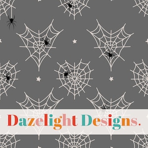 May include: A seamless pattern featuring white spiderwebs with black spiders on a grey background. The pattern is repeated throughout the image. The text "Dazelight Designs" is at the bottom of the image.