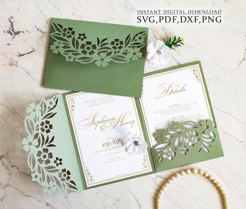 May include: A green and white wedding invitation with a floral design. The invitation is folded in half and has a pocket on the front for a smaller card. The text on the invitation reads "In honor of your presence at the marriage ceremony of Stephanie & Henry, 09/07, Two Thousand Twenty".