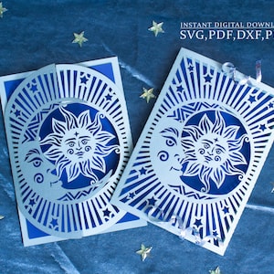 May include: Two blue and white paper cut-out cards featuring a sun and moon design with stars. The text "INSTANT DIGITAL DOWNLOAD SVG, PDF, DXF, PNG" is at the top of the image.