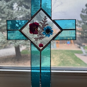 Stained glass cross with pressed flowers sun catcher.