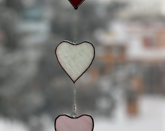 Stained glass heart sun catcher.