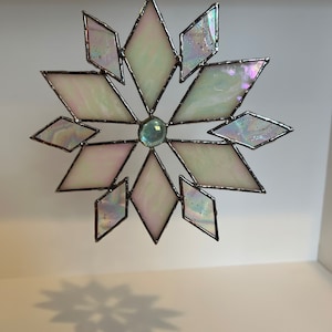 Stained glass snowflake sun catcher.