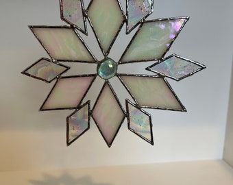Stained glass snowflake sun catcher.