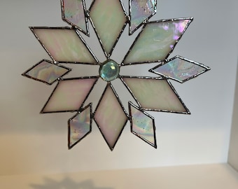 Stained glass snowflake sun catcher.