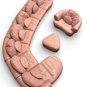 May include: A curved modular sofa set in a dusty pink hue, featuring a large multi-section crescent sofa, a matching armchair, and a triangular ottoman. Each piece has a soft, gathered texture with integrated circular back cushions.