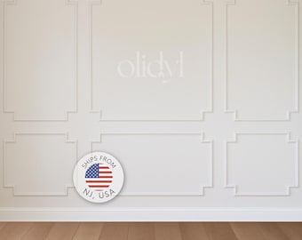 May include: A white wall with decorative molding and a wooden floor. The wall has a series of rectangular and square panels outlined with trim. A circular emblem with the American flag and the text "SHIPS FROM NJ, USA" is visible.