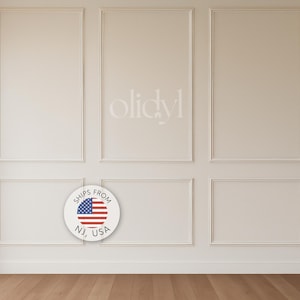 May include: A wall featuring rectangular panels and decorative molding in a neutral tone. The wall is divided into six sections, with a circular sticker that says "Ships From NJ, USA" with the American flag.